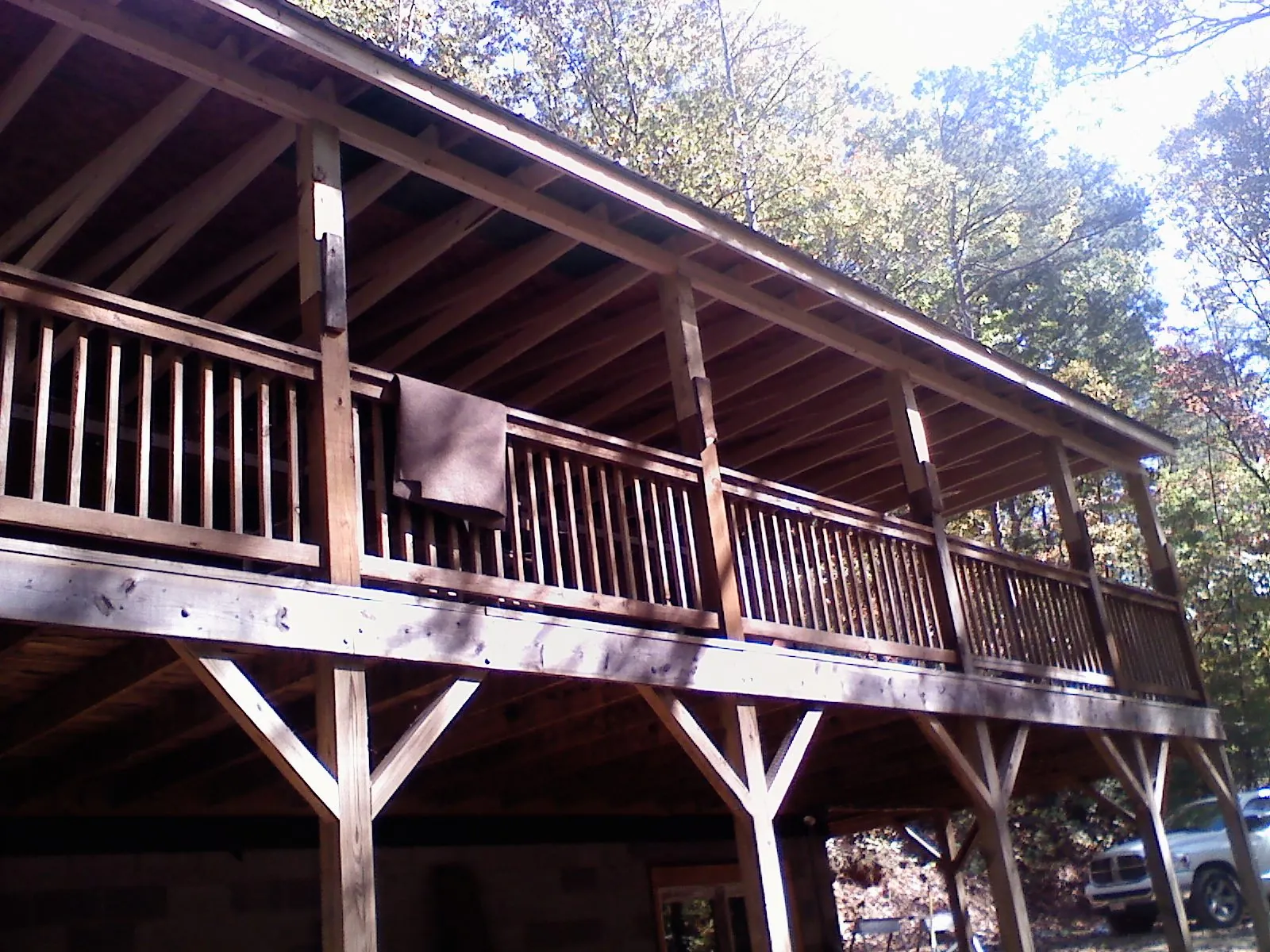Timber framing under a new elevated porch and deck — Roof Leak Repair in South Lyon by Roofing Brothers